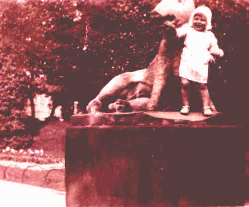 A young child i, posing at the Arboretum's Florentine Boar statue (1928)